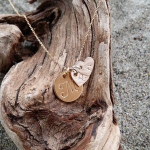 Gold monogram mothers necklac with silver hearts.